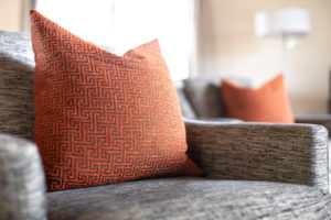 textured-throw-pillow-and-chair